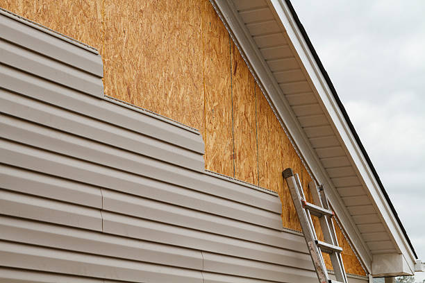 Professional Storm Damage Siding Repair technician working in Oakboro, NC